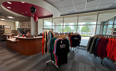 A view of inside the store with t-shirts and gear on display.