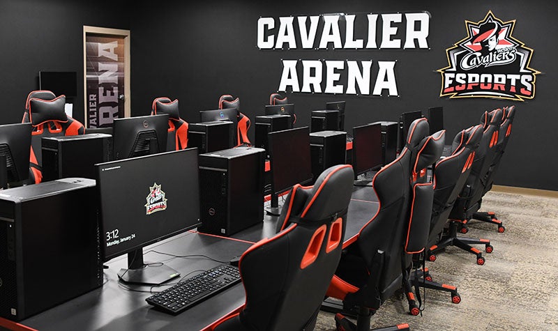 The Cavalier Arena with communal desks, computer monitors, and comfy gaming chairs.