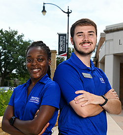Two Western safety officers wear blue polo shirts indicating they're here to support and protect students on campus.