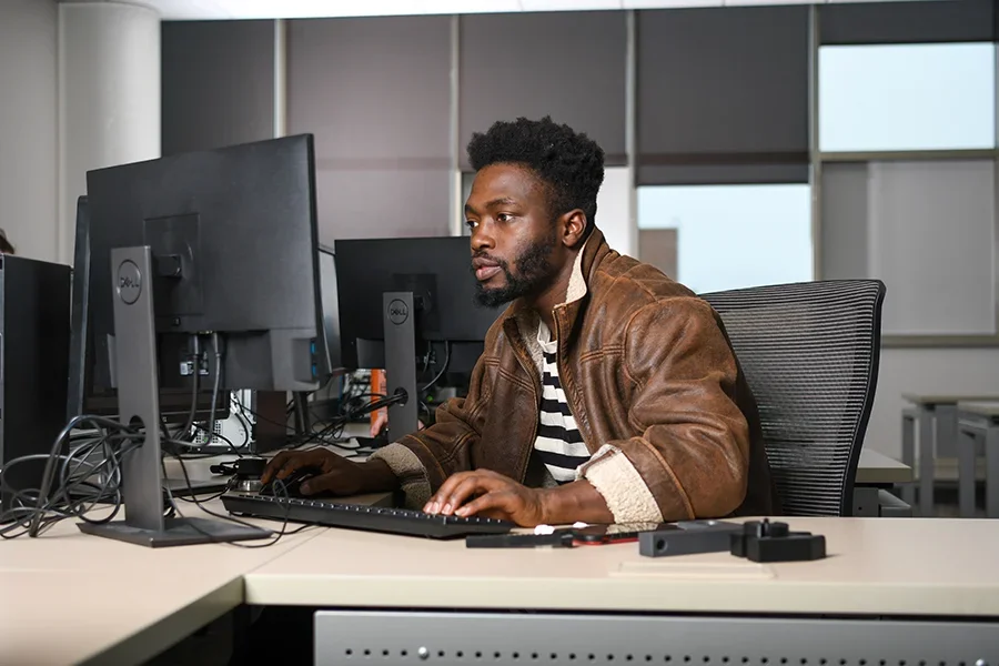 Person working on computer at desk