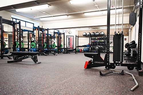 An area of the Wellness Center is dedicated to free weights and strength training.