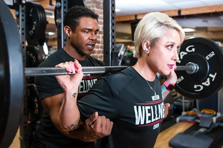 Two people working out in the Wellness Center