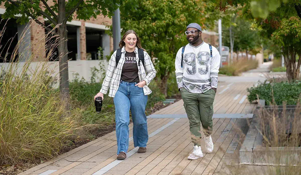 Two Western students walking in the courtyard