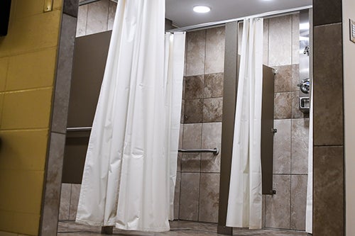 The locker rooms have private shower stalls and privacy curtains.