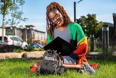 Student studying in the Urban Greenspace
