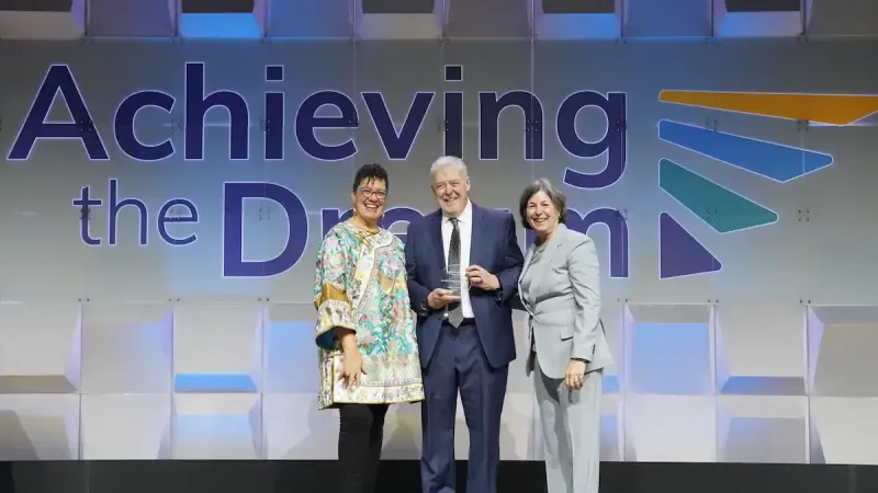 President Roger Stanford accepts award. 