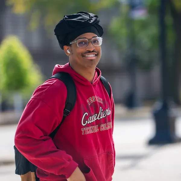 Male student, standing outside on Western's campus