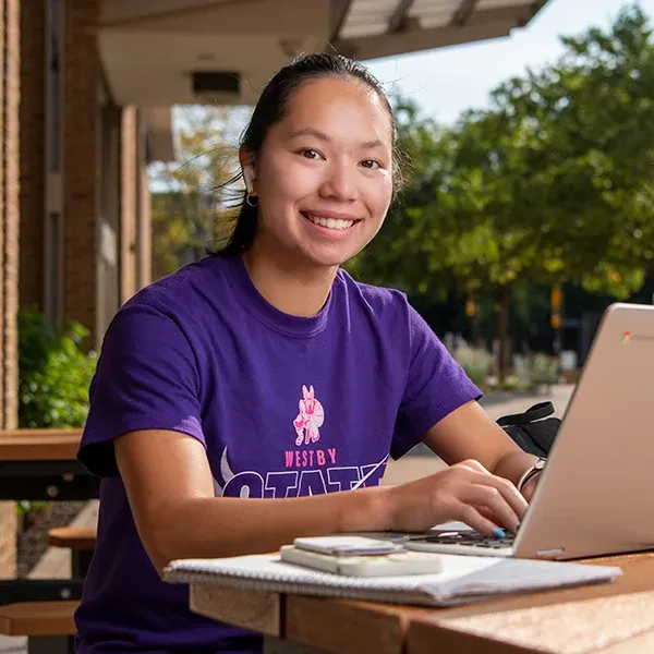 Female student, studying outside on Western's campus