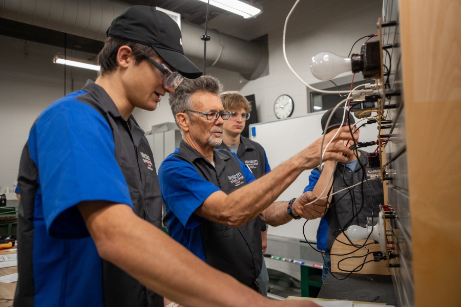 students and instructor work on electrical