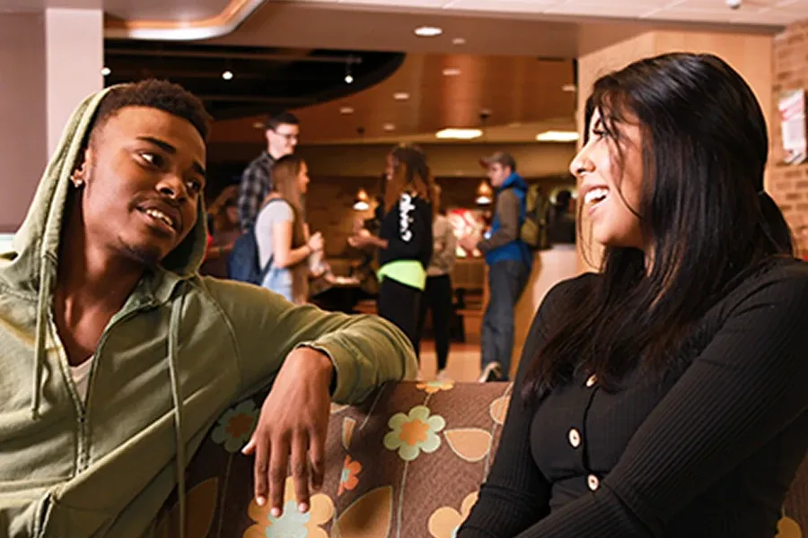 Two students talking in the Union Market at Western