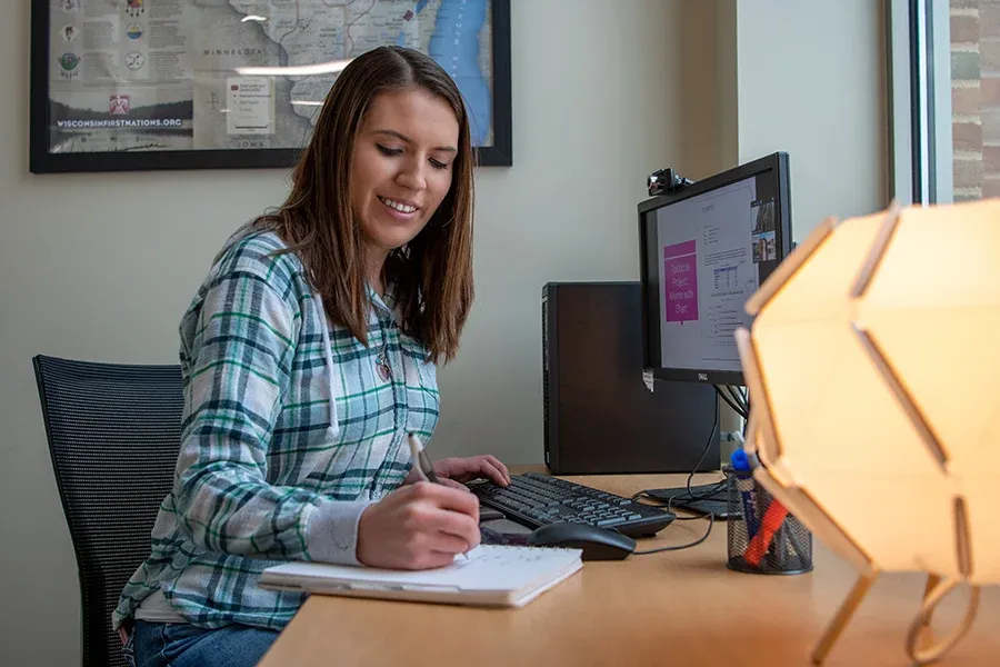 Student on zoom call taking notes