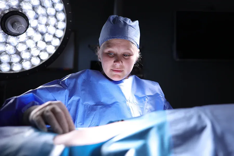 Girl practicing in operating room