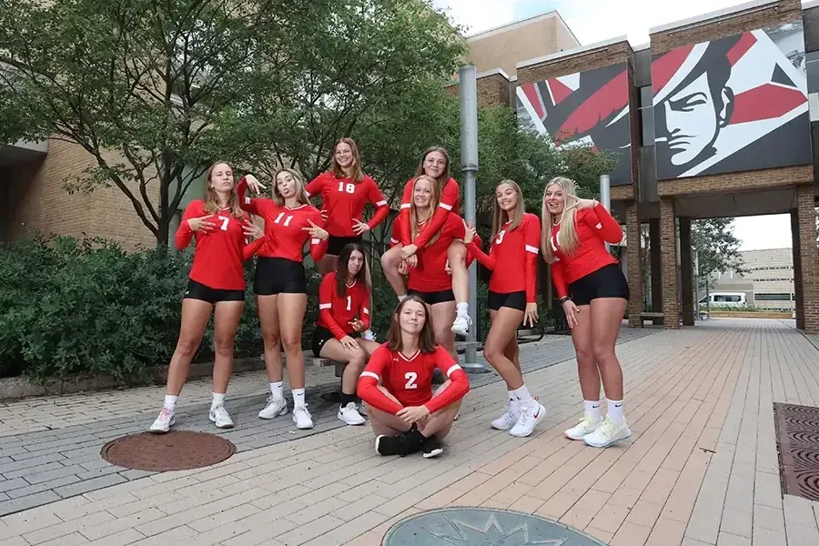 Western's volleyball team poses in the Cleary Courtyard
