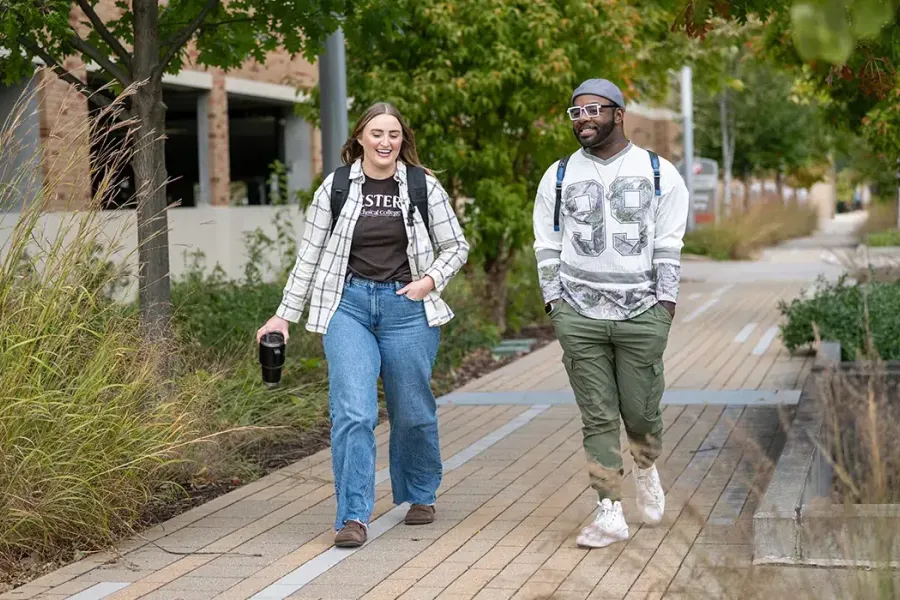 Two Western students walking in the courtyard