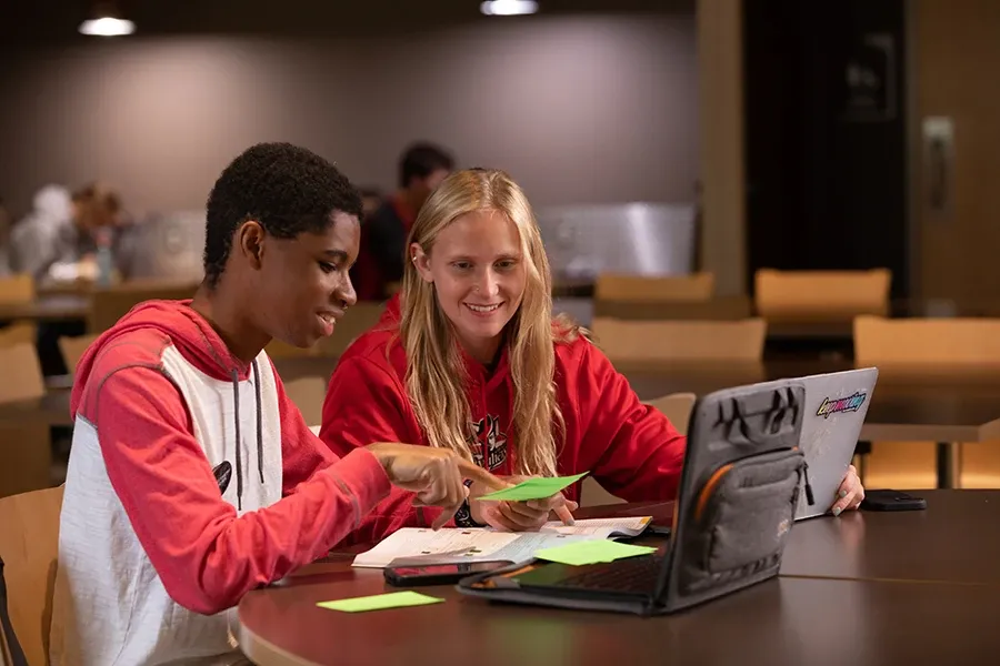 Two students studying together in the Union Market