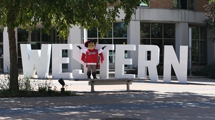 Cal in the Courtyard Cal the Cavalier with Western letters.