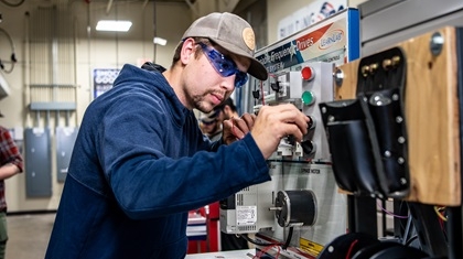 Electrical apprentice Electrical apprentice working on machine