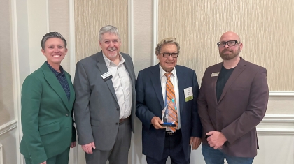 Ron Wanek accepts TECh award : WTCS President Layla Merrifield, Western President Roger Stanford, Award Recipient Ron Wanek, and Western Associate Vice President of Workforce and Innovation Josh Gamer are pictured as Ron accepts the 2025 Technical Education Champion Award during the WTCS District Boards Association meeting on October 17.