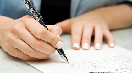 Person signing contract