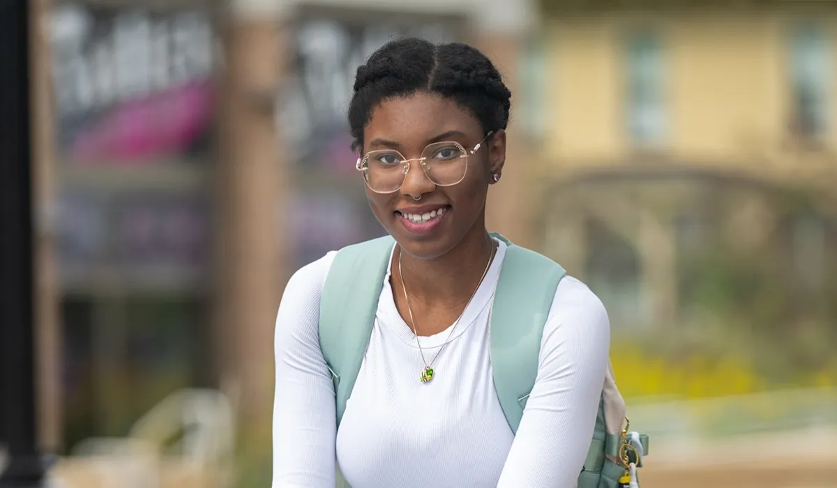 A female Western student, outside on Western's campus