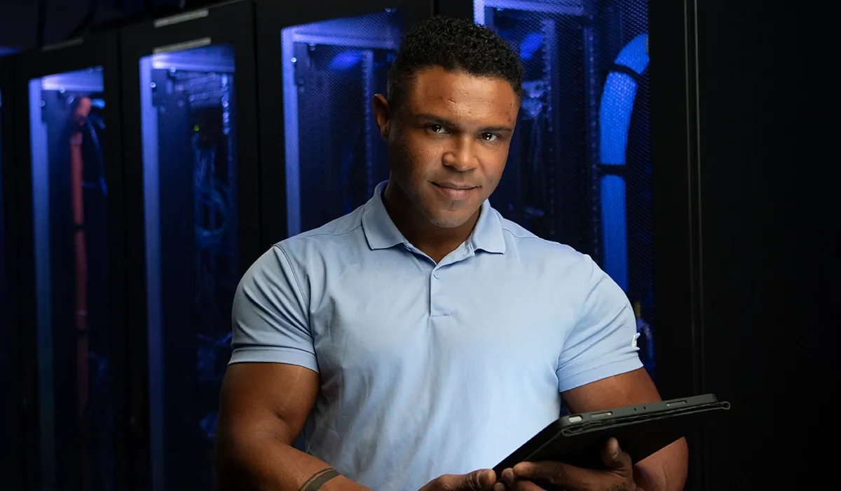 A male Western IT student in the server room