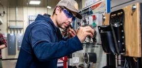 Electrical apprentice working on machine