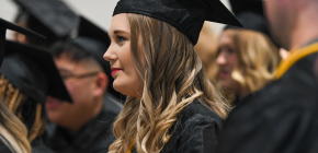 A Western Graduate Woman's profile at graduation ceremony